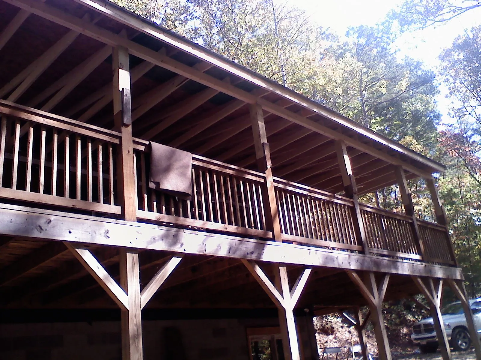 Timber framing under a new elevated porch and deck — Roof Leak Repair in Rosemont by Roofing Brothers